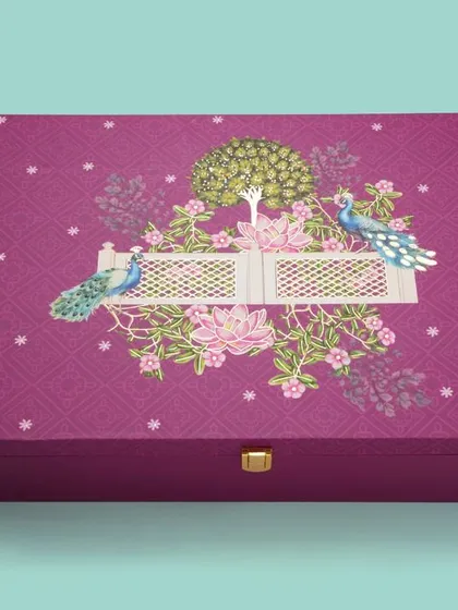 A premium, ornate purple gift box with a clasp, shot for a packaging catalogue. We highlight the unique features and high-quality details of the packaging.