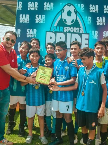 The winning team receives their championship plaque, a reward for their excellent teamwork and skill.