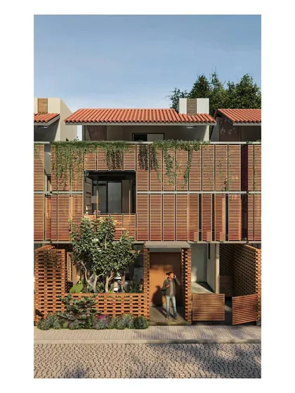This render illustrates a dwelling unit for the Benchmark Aradhya plotted development. The facade features a rich interplay of materials, including terracotta jali screens and wooden louvers, which provide privacy and ventilation while creating a warm, textured street presence.