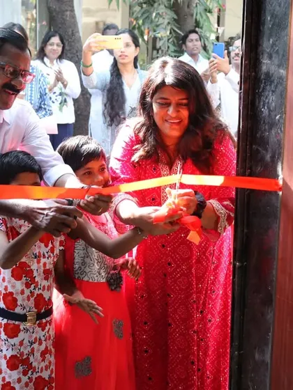 The official ribbon-cutting ceremony at our "Library of Flowers." Our founder, Seena Jacob, and the children celebrate the opening of this new safe haven.