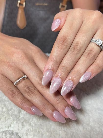 A beautiful set of shimmery lavender nails. The subtle glitter gives this classic color a magical touch.