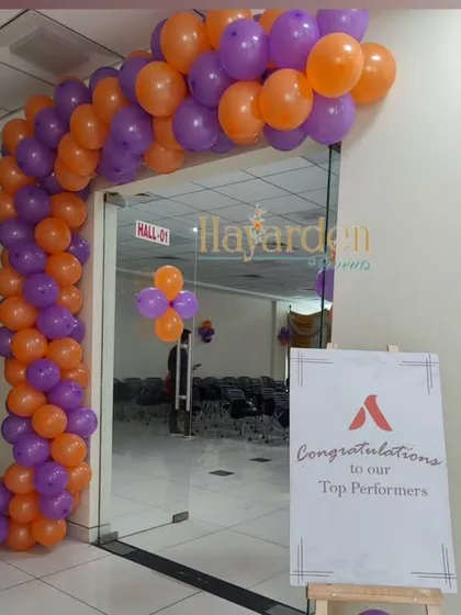 A balloon arch at the entrance of an office, congratulating top performers. This is a great way to celebrate team achievements.