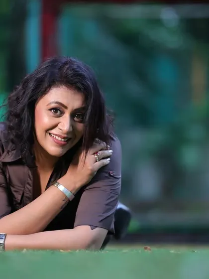 Actress Kashish Duggal in a relaxed outdoor setting. This image showcases a softer, more casual side, which is a great contrast to her more glamorous shots.