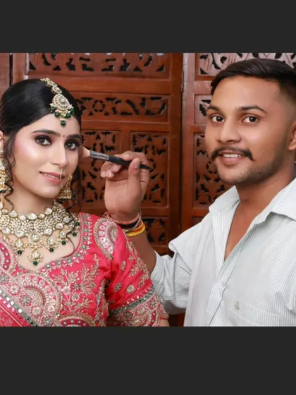 Another amazing creation by my student, Chetan. He is seen here giving the final touches to a beautiful bridal look.