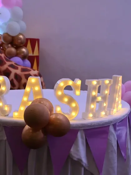 The birthday girl's name in lights! This custom marquee letter sign was a beautiful, personalized touch for the pastel circus party.