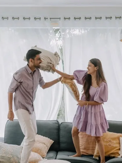 Our shoots are about being yourselves and having fun. We encourage playful, unscripted moments like this spontaneous pillow fight during a cozy indoor session in Goa, capturing the genuine laughter and joy that defines your relationship.