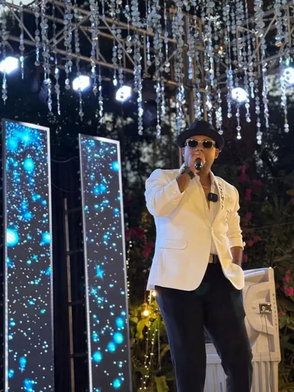 The stage is my canvas. Surrounded by elegant lighting and decor, I use my voice and presence to paint a memorable experience for every guest at the event.