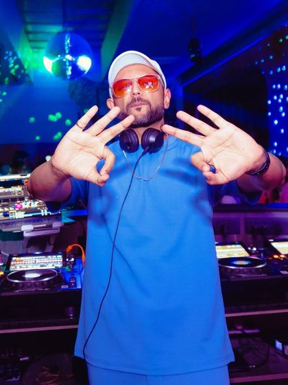 Another pose from the DJ booth, showing my confidence and readiness to rock the party.