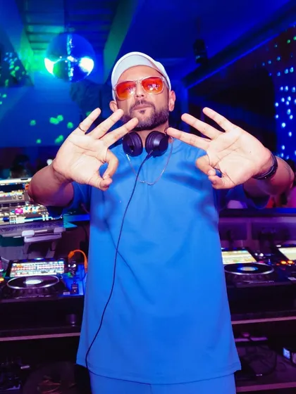 Another pose from the DJ booth, showing my confidence and readiness to rock the party.
