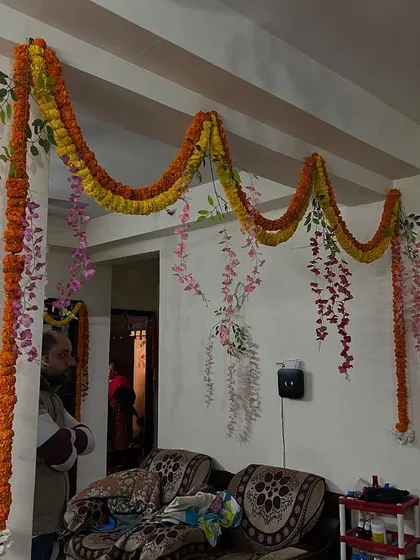 A floral 'toran' or garland hanging across the living room for a festive feel.