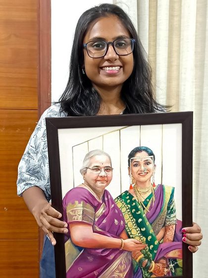 Here I am with the finished memorial portrait. It's a privilege to create art that holds so much meaning for a family.