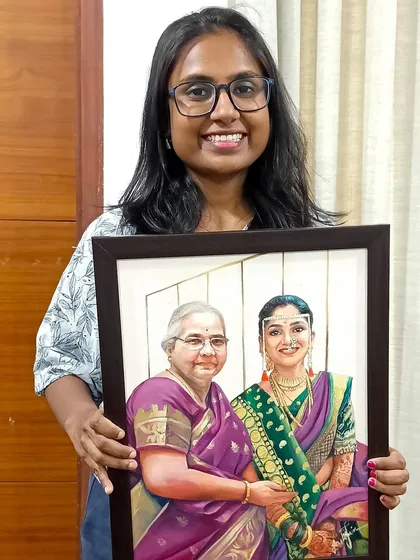 Here I am with the finished memorial portrait. It's a privilege to create art that holds so much meaning for a family.