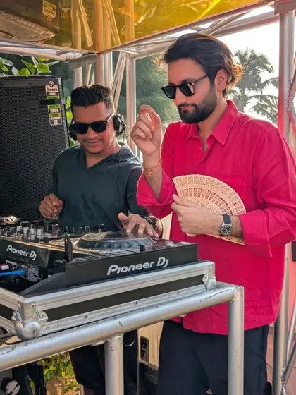 Enjoying the vibe with a guest at the Goa party. Creating a personal connection with the crowd is part of what makes a party successful.