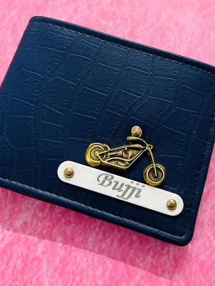 For the bike lover, this navy blue croc wallet features a motorcycle charm and a name on a white plate.