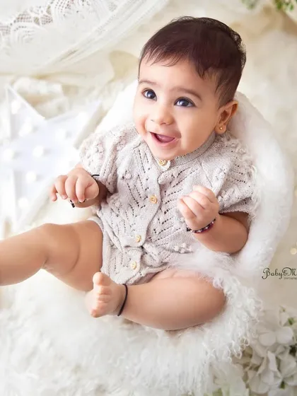 That sweet, excited expression is priceless. The overhead angle is great for capturing these moments in a simple, clean way.