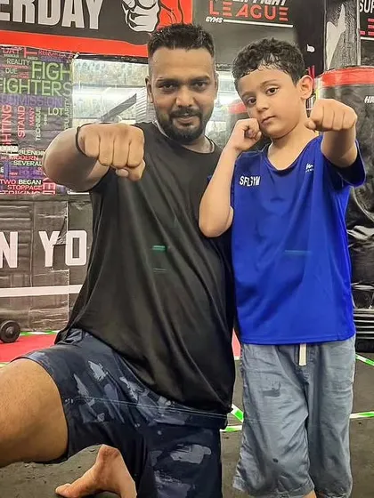Posing with one of my youngest students. It's never too early to start learning discipline and self-confidence.