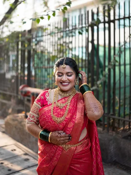 The bride's radiant smile is the highlight of this beautiful outdoor portrait.