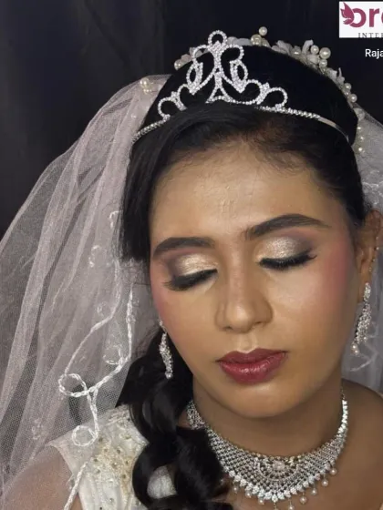 This shot with eyes closed highlights the shimmering eyeshadow and perfectly groomed brows, essential for a polished bridal look.