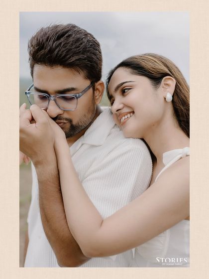 An intimate portrait focusing on the gentle touch and loving expression between the couple during their Udaipur shoot.