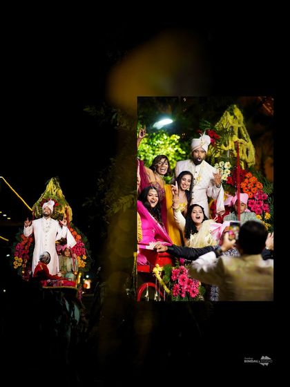 A candid shot of the groom's baraat, with friends and family enjoying the celebration. This photo captures the fun and energy of the procession.