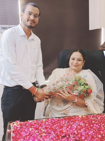 Presenting a bouquet to a respected senior or family member, whom I affectionately call Bhabhi maa.