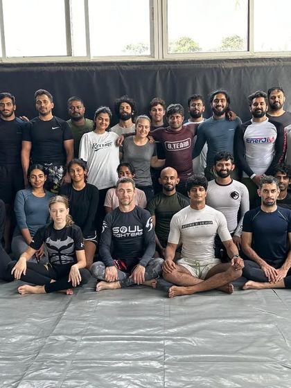 A group photo with my BJJ team. I maintain a white belt mentality, always open to learning and growing.