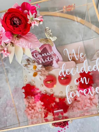 Our newest ring platter design, featuring a multi-layered name cutout and a window arch detail. The red and pink color scheme is perfect for a romantic celebration.