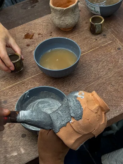 Applying a thick slip to a piece during the workshop. We experimented with a wide range of surface treatments to achieve rich, varied textures.