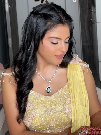 A beautiful profile shot showing off the soft glam eye makeup and the intricate hairstyle for this bride's engagement.