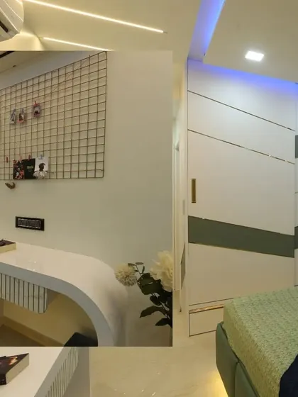 This bedroom includes a sleek, modern study desk with a grid board for notes and photos, seamlessly integrated into the room's design.