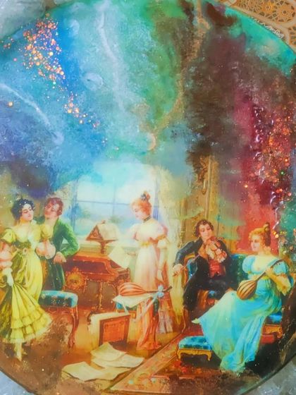 This mix-media art piece combines a classical decoupage image with a dreamy, cosmic resin background. The sparkling glitter and alcohol ink effects give it a magical and unique look.