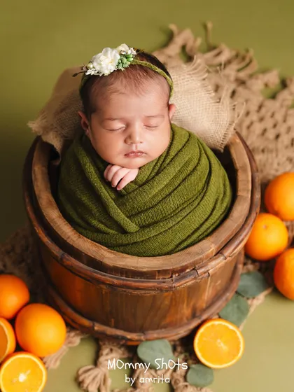 Learn to create vibrant, perfectly styled newborn portraits. This image, from one of our bootcamp sessions, shows how we combine color theory, prop styling, and safe posing techniques to produce stunning, memorable shots that will elevate your portfolio.