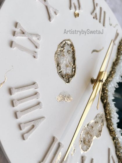 Another detailed shot of the geode clock, highlighting the delicate golden hands and the textured Roman numerals.