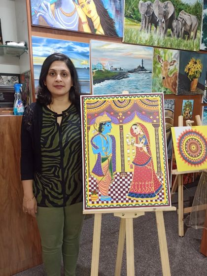 Prathima with her completed Madhubani painting. My classes guide you through the unique history and techniques of this beautiful folk art from the Mithila region of India.