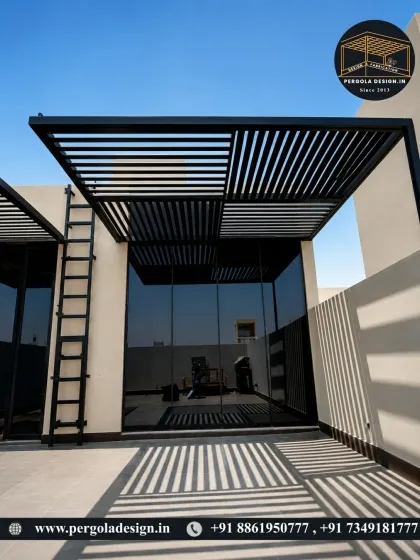 A minimalist pergola casting dramatic shadows on a sunny day. The design features a unique, partly-open roof pattern, creating a visually interesting and artistic shade solution.