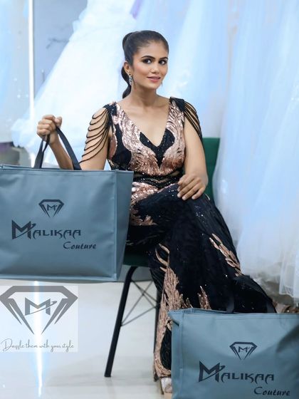 This black and gold sequin mermaid gown is pure glamour. The intricate pattern and beaded shoulder details make it a true work of art, perfect for a red carpet moment.