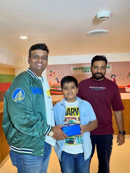 A student from our abacus program receives his prize at our celebration event. Every student's success is a win for the entire academy.