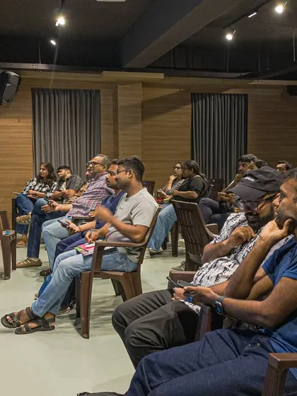 An audience listening during a weekend event. Our performance space is designed to be intimate, fostering a close connection between the speaker and the listeners.