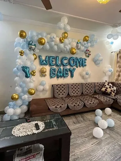 Another perspective of the living room setup, showing the full extent of the balloon decorations.