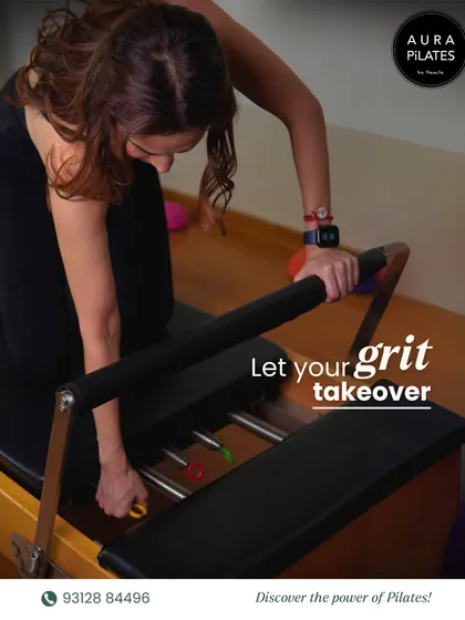 Let your grit take over. This image captures the moment a client adjusts the springs on her Reformer, preparing for the next challenge. My training builds not just muscle, but character and determination.