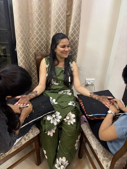 The 'dulhe ki behen' getting her mehendi done by my team. We make sure everyone is comfortable and has a great time.