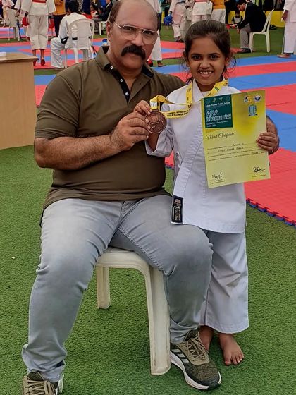 A proud moment with one of the day's winners. Seeing the joy and sense of accomplishment in a young student's face is the greatest reward for an instructor.