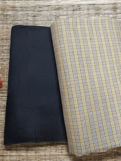 This beige and navy plaid woolen fabric is a sophisticated option for a custom-stitched winter suit or blazer.