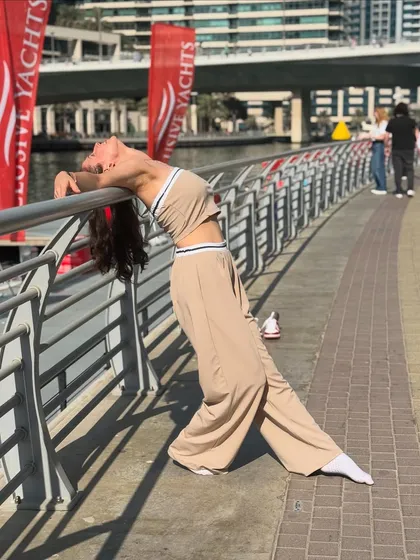 Leaning into the new year with grace and strength. A backbend pose against the beautiful backdrop of the Dubai Marina.