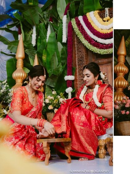 A beautiful ritual where the bride's feet are honored. This shot captures the tradition and the vibrant colors of the ceremony.