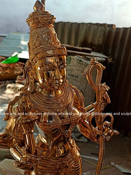 A 25-inch bronze Kamakshi idol, shown here after polishing in our workshop. The radiant finish highlights the intricate details of her sugarcane bow and other attributes.
