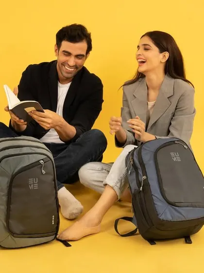 This lifestyle shot for a backpack brand captures a candid, happy moment between two people. It positions the bags as perfect companions for work, study, or everyday life.