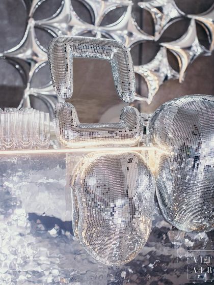 The bar for the after-party was a work of art, featuring mirrored blobs and amorphous shapes that seemed to melt into one another. This design played with light and reflection to create a dynamic, futuristic, and incredibly cool focal point.