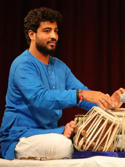 A smile of satisfaction after landing a complex rhythmic cycle during my solo.