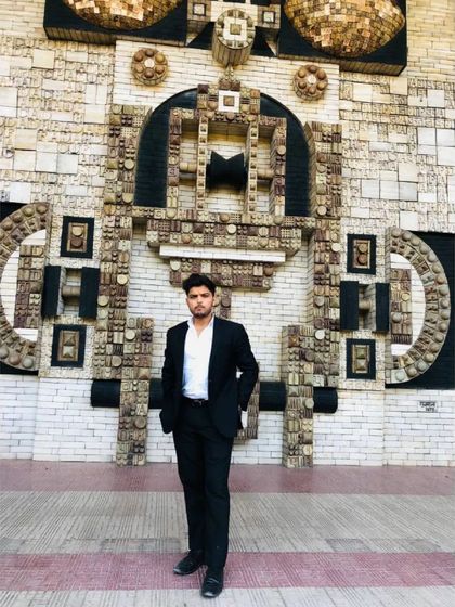 Posed against an artistic wall at a court complex. I am an attorney at law, and I carry that title with pride and responsibility.